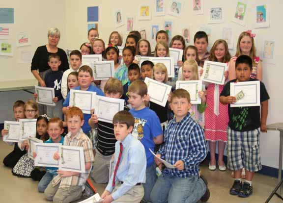 Junior American Citizen winners with Butler County DAR Chairman Laura Crafton.  Students won in the Stamp and Poster dividion.Ten students placed at the state levelgoing on to the East CEntral Division, where Butler County had two first place and one second place.  Winners went on to Nationals, where Butler County received a first place and honorable mention.