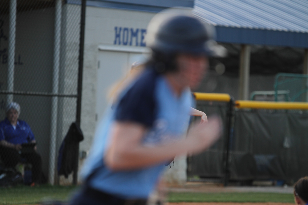 The lens was focused on third base, this was taken in one shot AF- so the lens didn't readjust to the moving subject