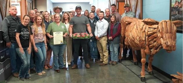 Commissioner of Agriculture Jonathan Shell, center, was surrounded by Kentucky beef industry personnel and producers as he celebrated May as Beef Month in Kentucky at The Yards in Lexington. The Yards, in the Blue Grass Regional Stockyards Marketplace, is an education center focusing on science and practices of the beef industry. 