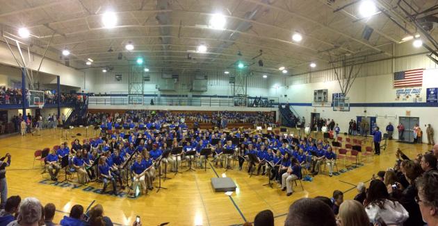 7th and 8th grade bands perform with the 5th grade band in the background.