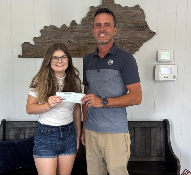 Butler County Farm Bureau Insurance Manager Bobby Smith presented Skylar Webster with a $1,000 scholarship.