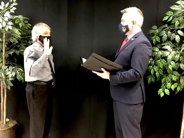 Stevie Givens being sworn in by Ryan Quarles