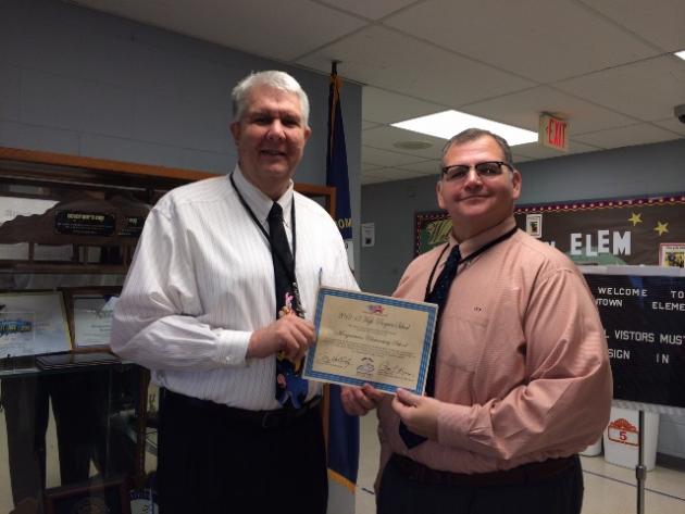 Mr. Greg Woodcock (left) Morgantown Elementary Principal and Mr. J. Chad Flener (right) are shown with the certificate awarded to Morgantown Elementary by the Kentucky Board of Education