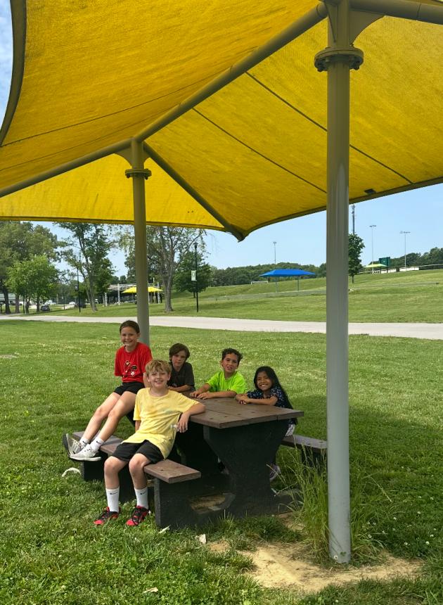  MES 3rd graders enjoying the picnic tables at Morgantown City Park made from recycled tire waste. Photo credit: Zac Johnson
