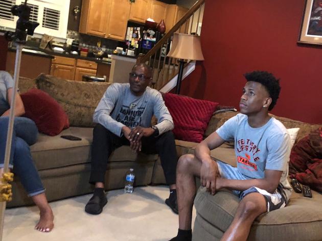  Junior point guard Jeremy Roach watching TV with his father, Joe. Roach was the first point guard in the 2020 recruiting class offered by John Calipari. (Samantha Pell Photo)
