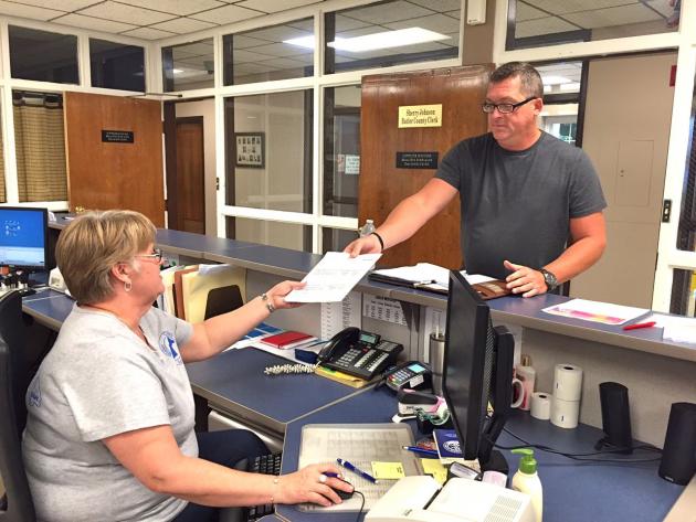 Josh Hampton, spokesperson for Citizens for a Better Butler County, presents a local option "wet-dry" petition to Butler County Clerk Sherry Johnson.
