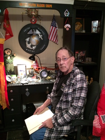Joe in his room dedicated to Marine Corps memorabilia.