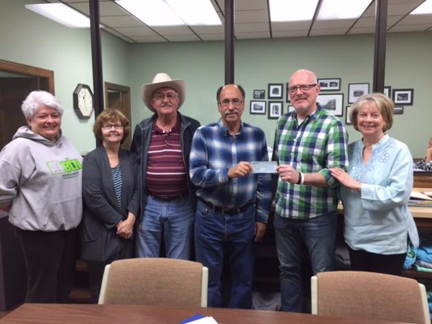Tommy Hines, Green River Museum Director (second from right) receives a 3,000 dollar check in support of the museum from members of the Morgantown-Butler County Tourism Commission. 