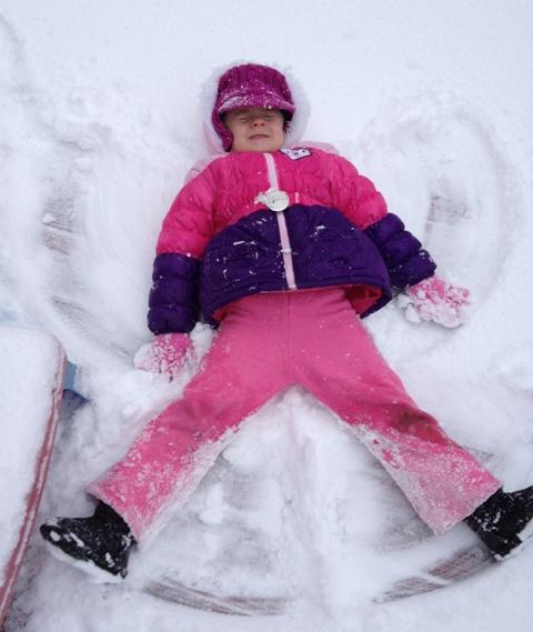 Jenna Brooks making snow angels.