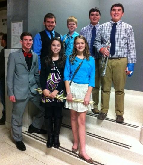 Honors band students  (Delaney Embry, Justin Hudnall, Clay Johnson, Cole Johnson and Reece Robbins) after the concert with student assistants, Tristan Elmore and Chase McCoy.