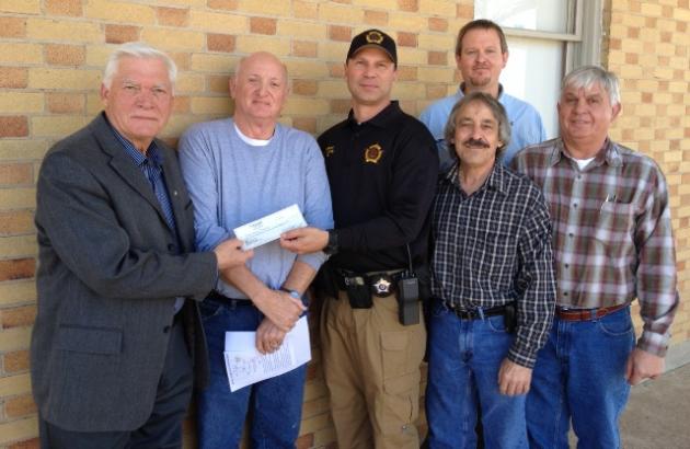 Sheriff Scottie Ward gave the squires a check for $22,632.74 for the 2013 settlement  of the sheriff's office.