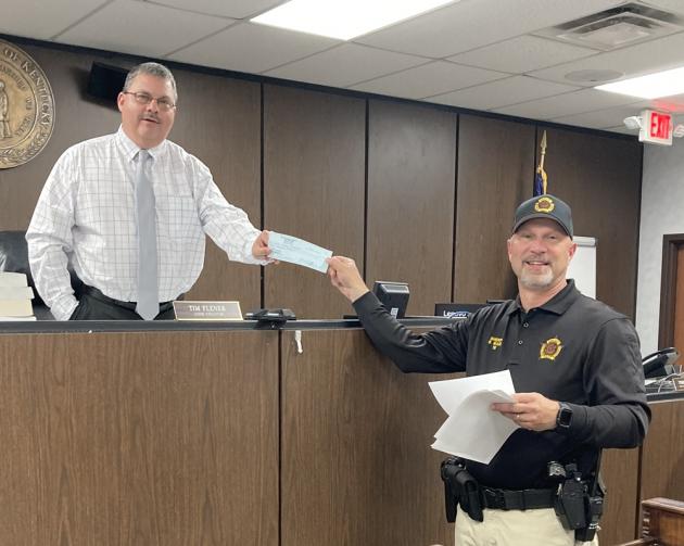 Butler County Sheriff Scottie Ward presented a $62,438.94 check of his excess funds to the court.