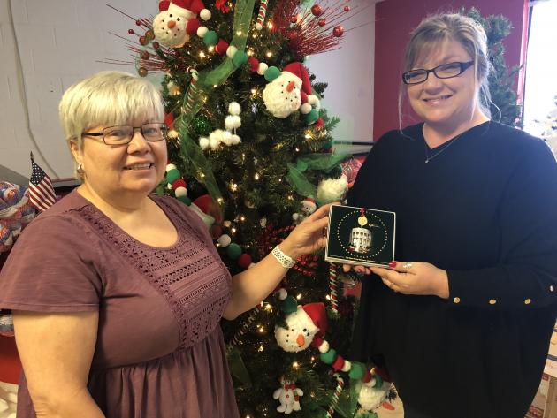 Festival Chair Laura Crafton presented Carrie West a 2018 White House Christmas Ornament for their efforts. Positive Directions is an Adult Day Treatment facility located in Rose Plaza.