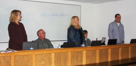 Swearing in of school board members Karen Evans, Debbie Hammers, and Charles Price.