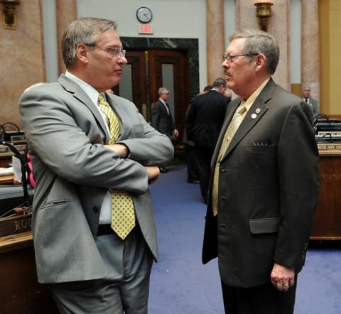 Rep. C.B. Embry, Jr., R-Morgantown (right) discusses legislation with Rep. Rick Nelson before the start of the March 6th session of the Kentucky General Assembly. (Photo: LRC Public Information)