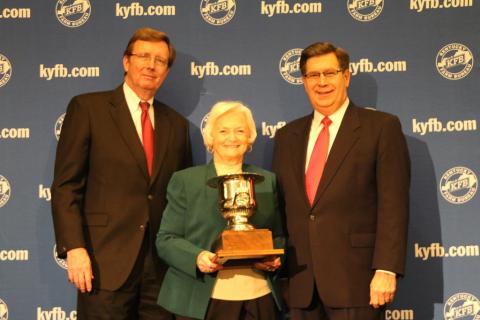 Betty Farris, President of Butler County Farm Bureau (center), accepts the “Top County” award from David S. Beck, KFB Executive Vice President (right), and Bradley R. Smith, KFB Insurance Companies Chief Executive Officer (left).