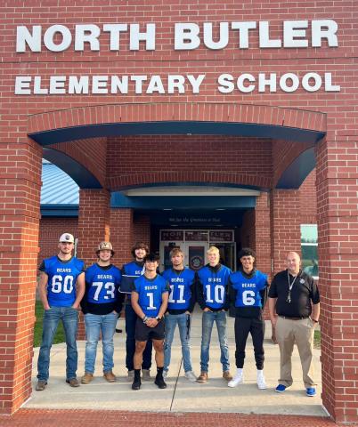 BCHS Football players greeted students at NBES this morning.