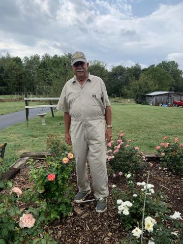 Ricky at home with his roses.