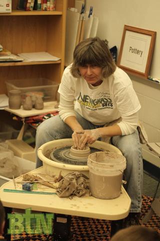 Suzanne Renfrow working in clay.