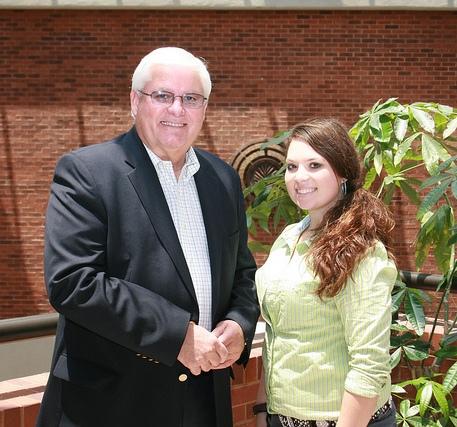 Tori Fugate (right), of Morgantown, KY, is greeted by Mark Haney, president of Kentucky Farm Bureau (left), during the 2012 Institute for Future Agricultural Leaders (IFAL).