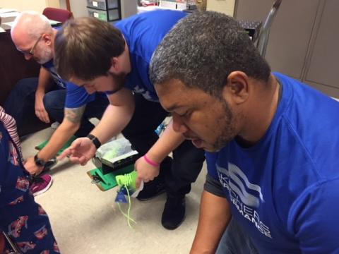 Butler County students being measured for shoes.