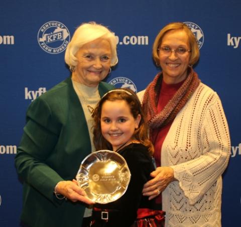 Rita Drake (right), chair of the Butler County Farm Bureau Women’s Committee, and Maggie Drake (center), accept the 2014 Gold Star Award of Excellence from Betty Farris (left), chair of the Kentucky Farm Bureau state Women’s Committee.