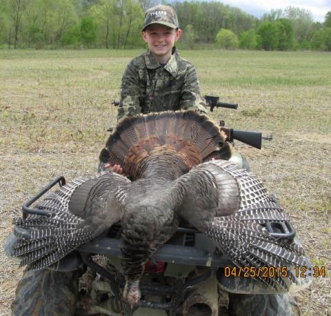 Braiden Martin and his first of many turkeys to come.