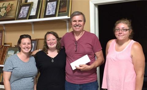 Richland Baptist Church members Dana Pendley and Janesa Webster present check to Garry McKinney and Rachel Towe