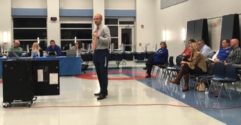 NBES Principal Josh Belcher presenting testing results to the board.