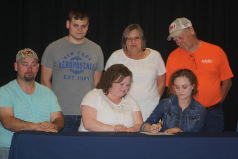 Cross country and track and field standout Olivia Neighbors signed a letter on intent to play at Brescia University Monday.