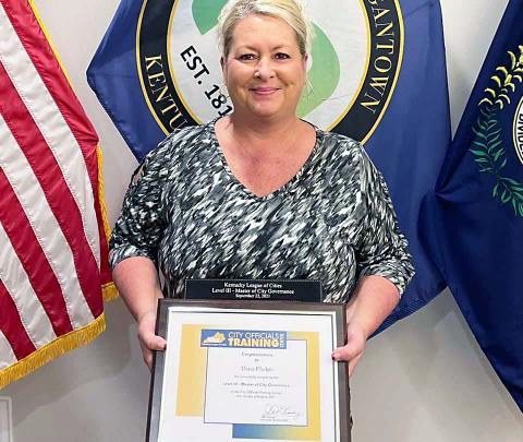 Morgantown Assistant ABC Administrator Dana Phelps with a KLC Level III award for Master of City Governance.   