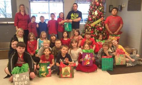 Ms. Elmore's class presenting gift bags to Mr. Richie Bratcher of BCCA.