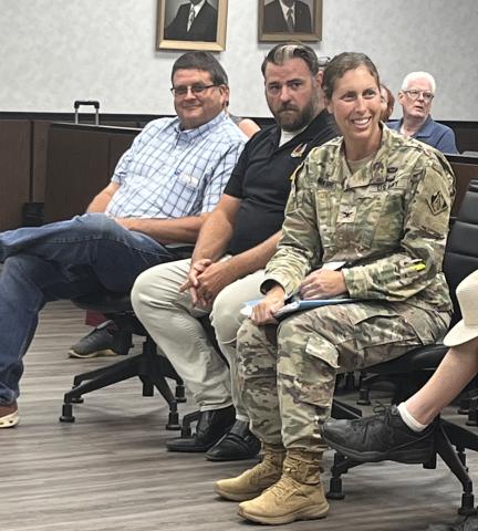 Lee Andrews, Chris Wernick, and Colonel Lisa Mann