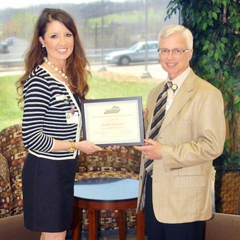 Kaitlin Harrison, RD, LD is congratulated by Wayne Meriwether, MHA, Chief Executive Officer at Twin Lakes Regional Medical Center upon being named the 2014 Kentucky Young Dietitian of the Year by the Kentucky Academy of Nutrition and Dietetics.