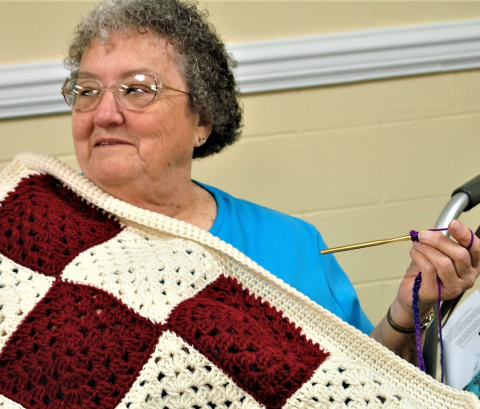 Alice Cox finishing a bed shawl.