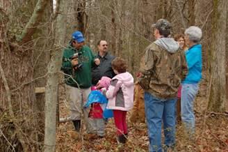 Greg Drake prepares to tap a tree for a maple syrup production class in 2012