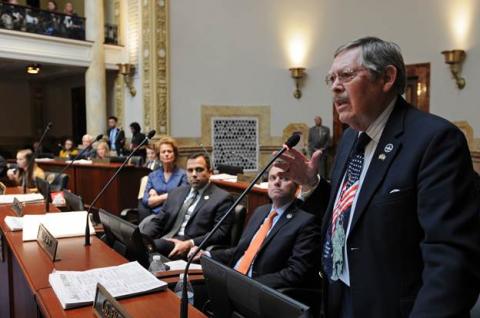 State Senator C.B. Embry (right) rises to speak on the Senate floor on Feb. 16. (Photo: LRC-PI)