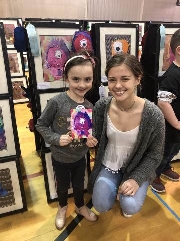 Nora Lindsey (Kindergarten) with Camryn Newland (11th grade)