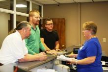 Roger Givens, Cody Donaldson and Josh Hampton turns petition in to Butler County Clerk Sherry Johnson