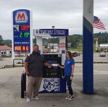 Kelsey Hood Lee - Hood’s Market Manager as she presents a check to Ryan Emmick - Director of School Safety
