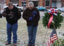 P.R. Webster of the American Legion and Sharone Nash of the VFW assist in the laying of the wreath.