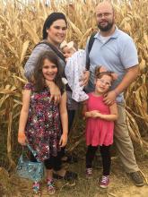 THE PHELPS FAMILY Ashley & Ben with the girls: Mishka, Amelie, and baby Hadassah Rose.