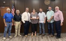 Magistrate Dillon Bryant presented his "celebration" money to the Gilstrap Community Center for repairs.  Ruth Kiper accepted the money on behalf of the center. 
