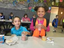 MES 1st grader Denzil Burden and MES kindergarten Nevaeh O’Neal enjoying smoothies on kickoff day.