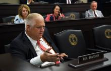It shows Rep. Kevin D. Bratcher, R-Louisville, asking a question.