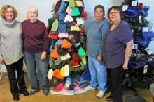 Brenda Jenkins, Beverly Hayes, Linda Pendley and Christine Bratcher set up the tree