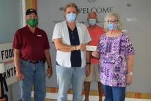 Accepting the donation from Paradise Chapter president Patricia Cobb is Garry McKinney of The Morgantown Mission. Also present in the picture is Gary Southerland, past president of the Paradise Chapter.