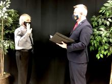 Stevie Givens being sworn in by Ryan Quarles