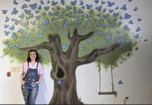 Gabrielle Stark, was commissioned to paint a mural on the wall.