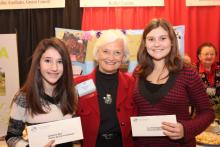 Eighth grade student Katherine Rice (left) and seventh grader Taya Strasburger (right), who both attend Butler County Middle School, are presented with an award of recognition by Betty Farris, First Vice Chair of the Kentucky Farm Bureau Women’s Committee (center), for their participation in the 2012 Science in Agriculture program.